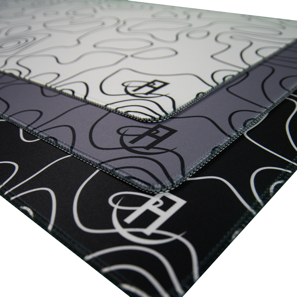 white topography gaming mouse pad, black topography gaming mouse pad, grey topography gaming mouse pad layered on eachother