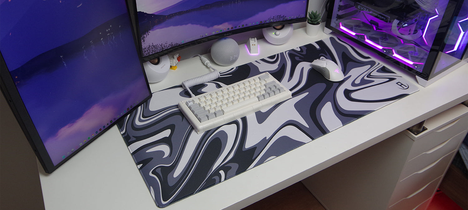 Black and white liquified gaming mouse pad in a gaming setup
