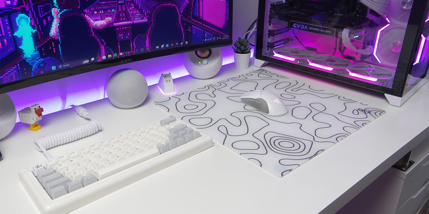 white topo glass mousepad in gaming setup that is all white and fairly minimalistic