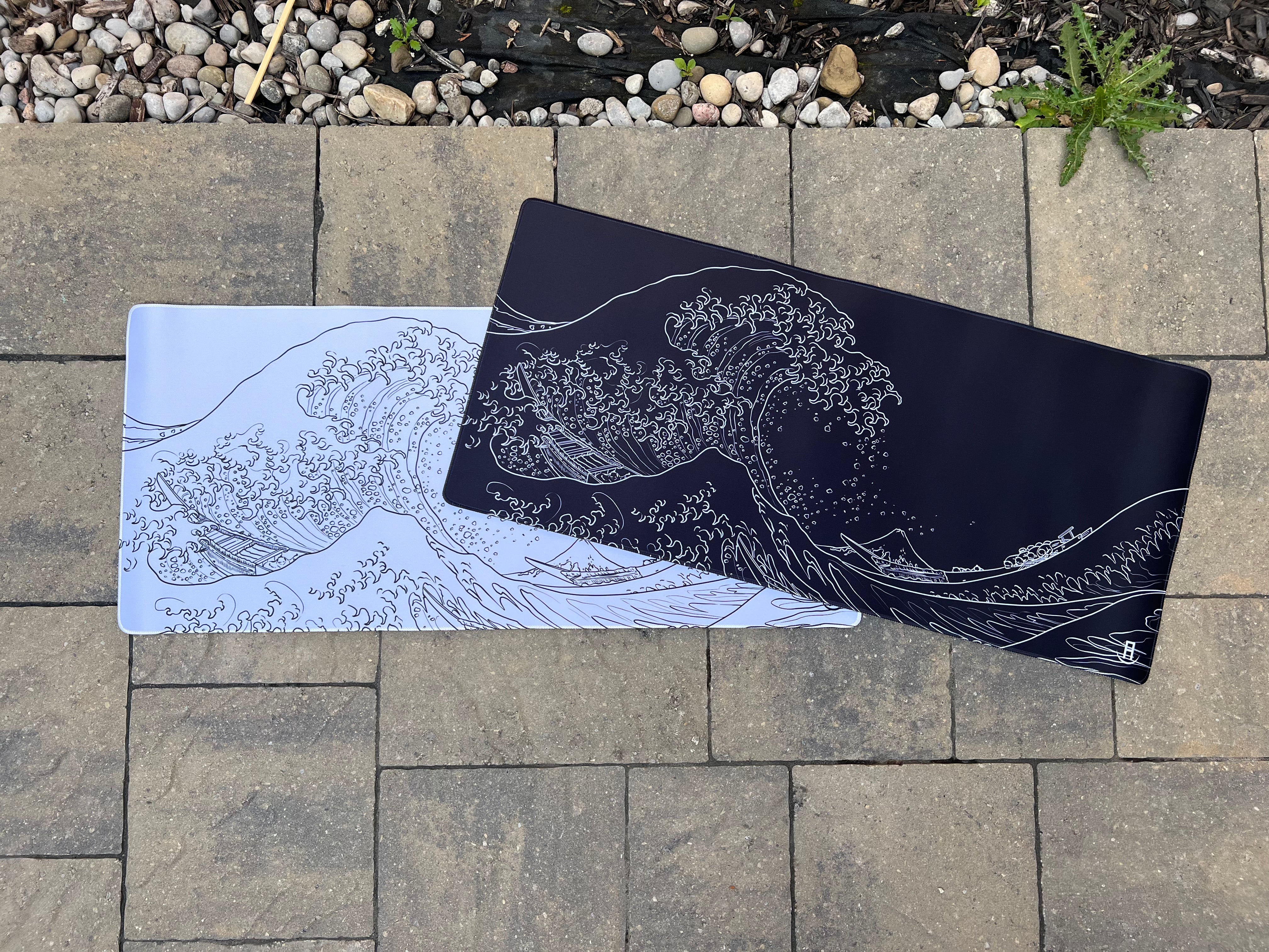 The great wave of kanagawa black high quality desk pad and The great wave of kanagawa white high quality desk pad outside 