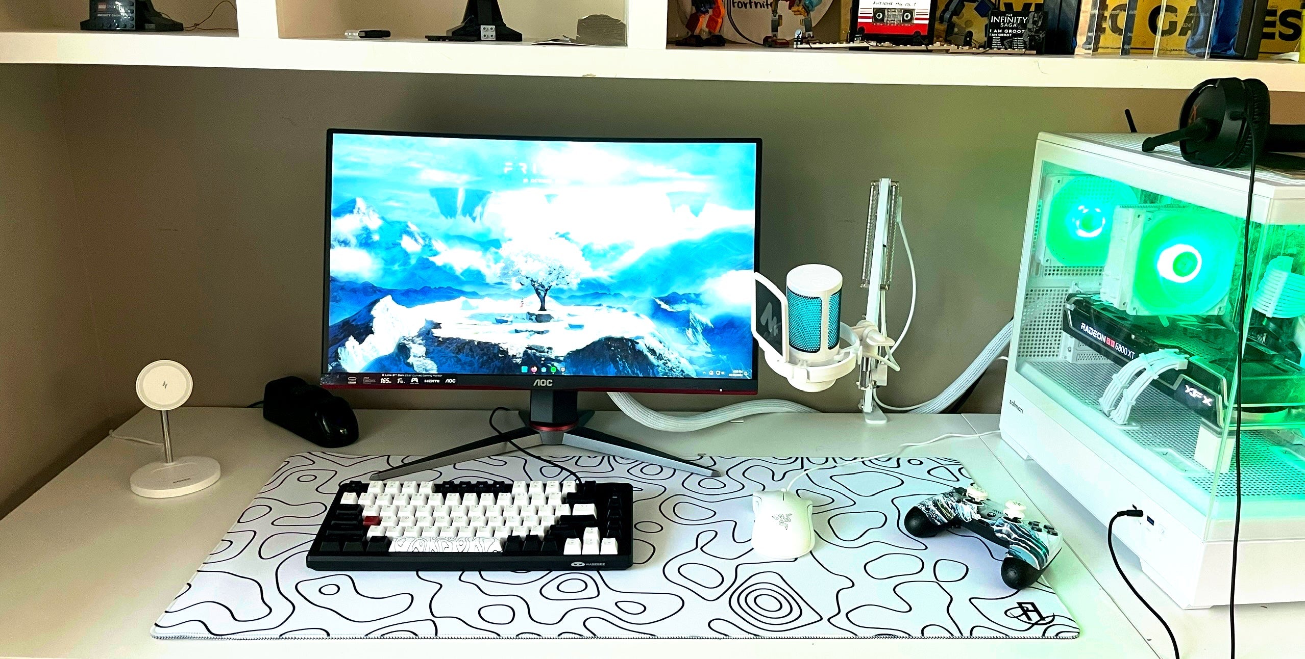 white and green gaming setup with white topography mousepad